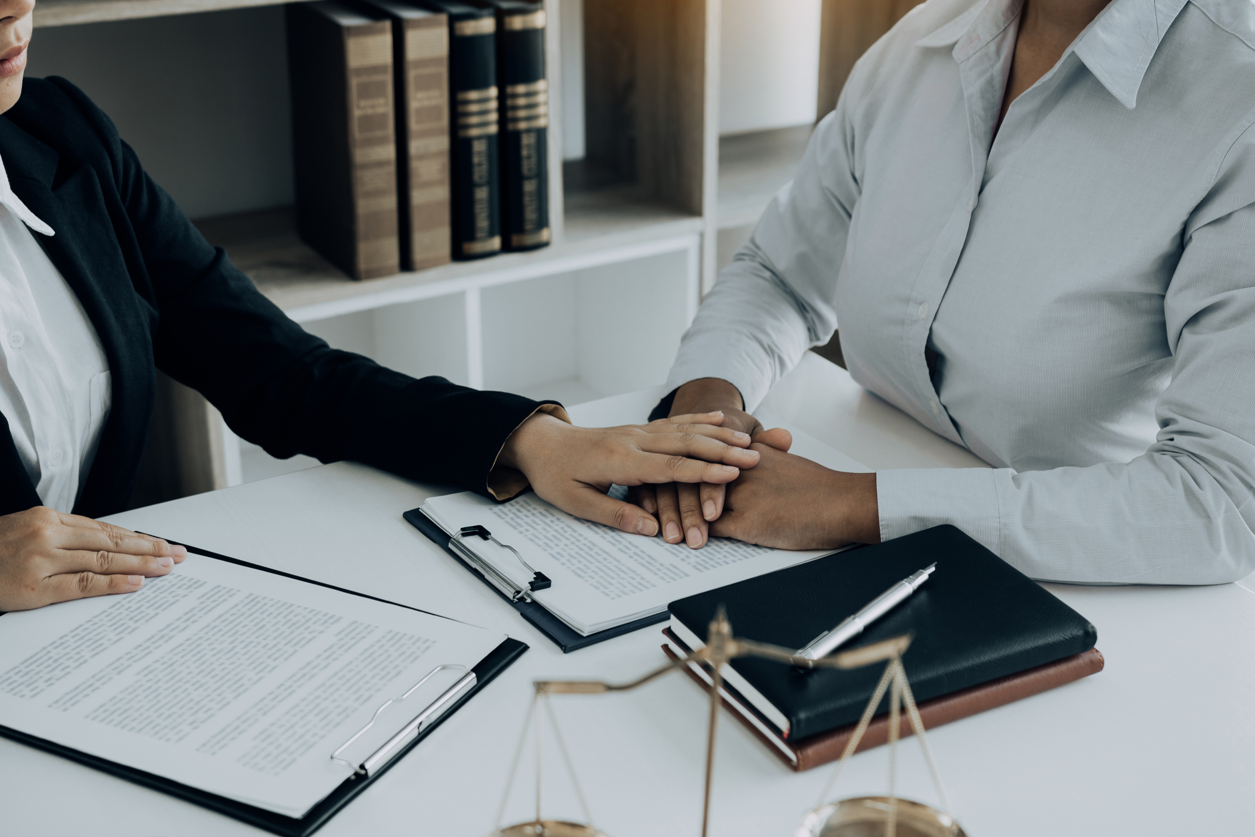 An advocate meeting one-on-one with a client